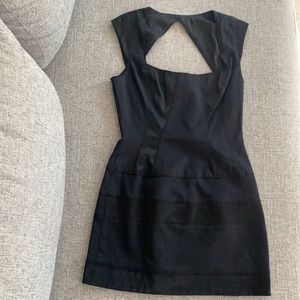 Like new Bebe black dress with left side zipper and clasp, size 4
